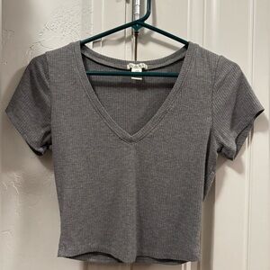 Gray v-neck ribbed crop top.